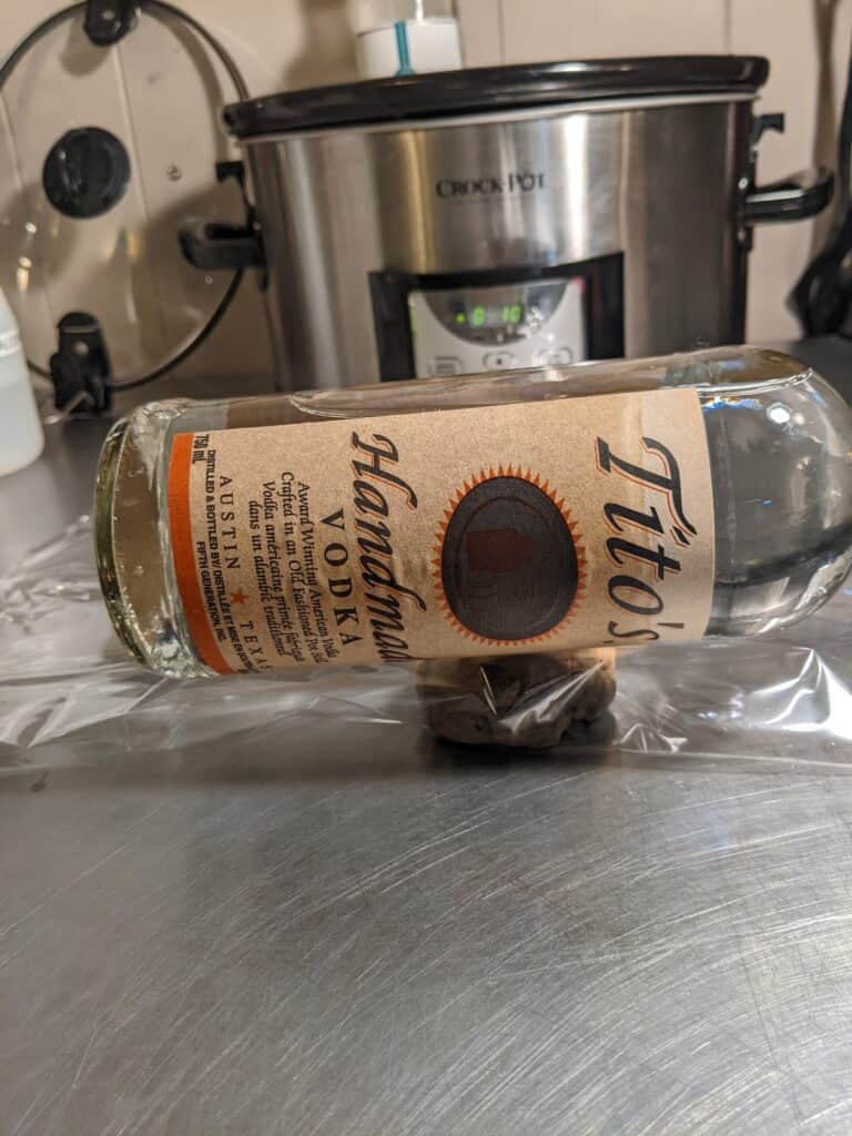 pressing hash with hot wine bottle