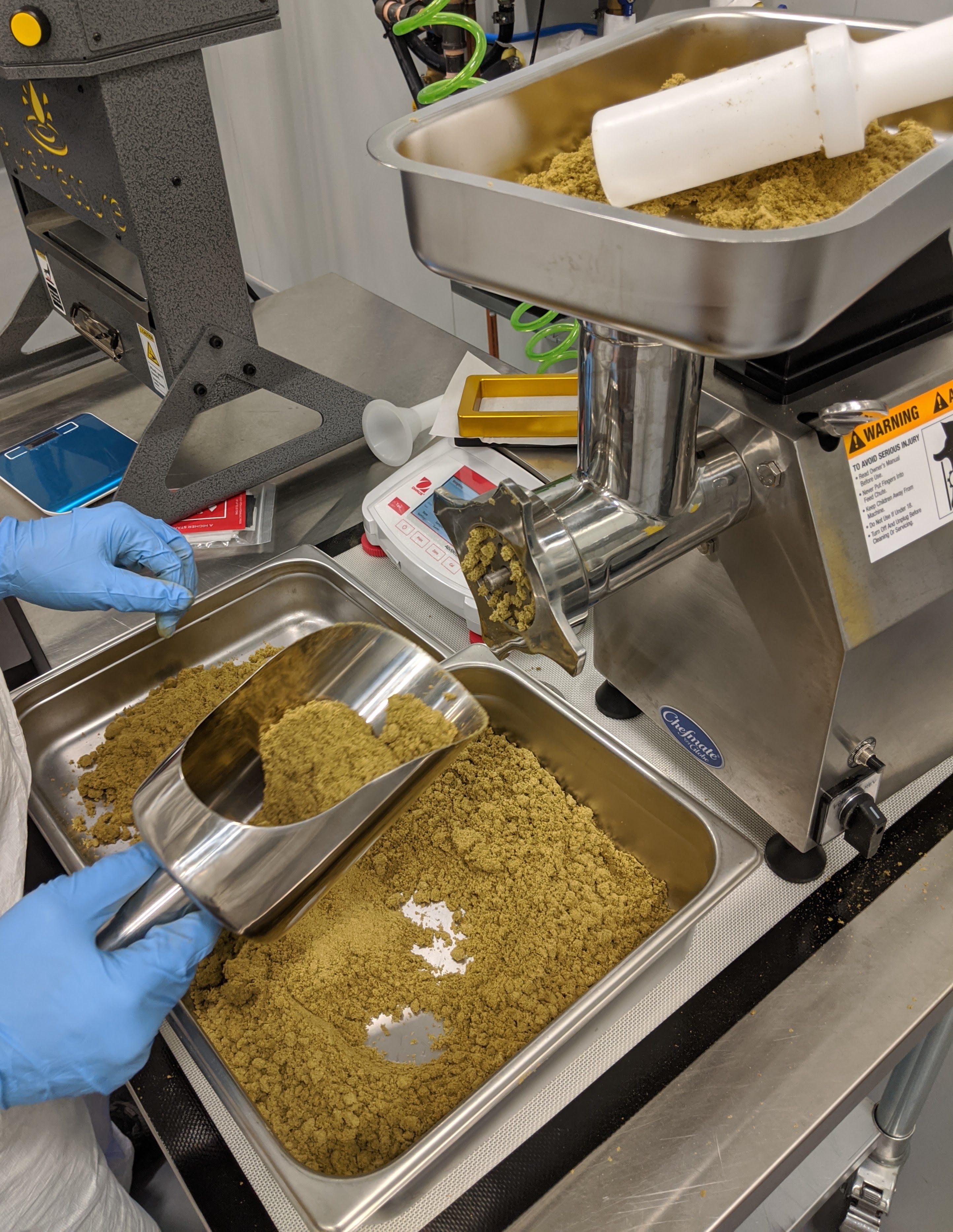 meat grinder being used to make traditional hash